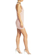 Yonit Dress pale pink knit mini dress viewed from the side with distressed hem and metallic strappy heels thumbnail image 3 of 4