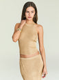 Model wearing a gold metallic knit halter top with a matching skirt and bold gold jewelry thumbnail image 1 of 5
