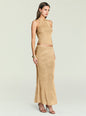 Model wearing a gold metallic knit halter top with a matching skirt shown in a profile pose thumbnail image 4 of 5