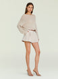 Beige Serafina Sweater tucked into light shorts with brown belt and nude heels, accessorized with gold jewelry. thumbnail image 3 of 5