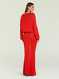 Back view of a model in a red knit cropped sweater with a matching red knit skirt thumbnail image 5 of 6
