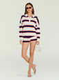 Model wearing Taby Sweater in white with navy and red horizontal stripes and a polo collar, paired with matching shorts. thumbnail image 5 of 5