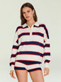 Close up of model wearing Taby Sweater with white base navy and red stripes and polo collar. thumbnail image 1 of 5