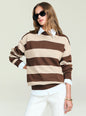 Woman in an oversized beige and brown striped knit sweater with white shirt underneath and sunglasses thumbnail image 1 of 6