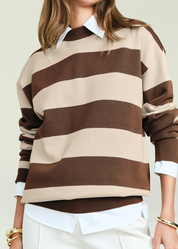 Bryn Knit Sweater with bold beige and brown stripes layered over a white collared shirt.