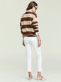Back view of a brown and beige striped knit sweater worn over a white shirt with white pants thumbnail image 5 of 6