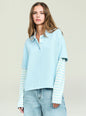 Emilee Top in light blue polo layered over a striped long sleeve worn by a model with denim jeans. thumbnail image 1 of 5