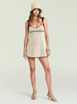 Model wearing beige crochet mini dress with brown trim and tie shoulder straps, straw hat and sandals thumbnail image 1 of 5
