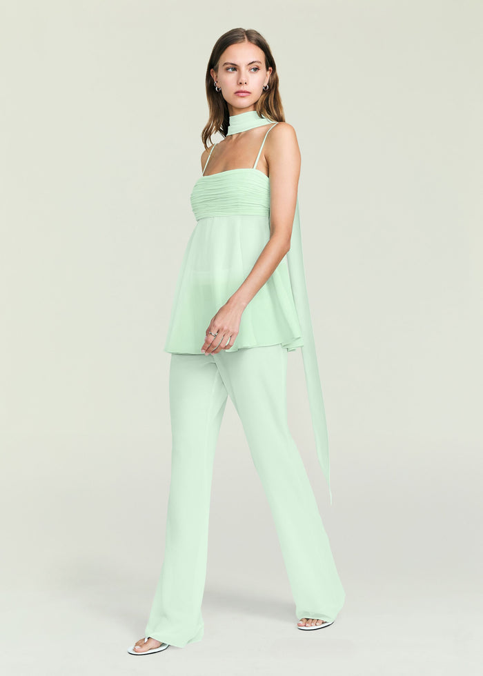 Model wearing the Mave Pant set in mint green with ruched top and flowing wide leg pants.