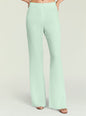 Mint green Mave Pant close up at the waist and legs with hands in pockets thumbnail image 1 of 5