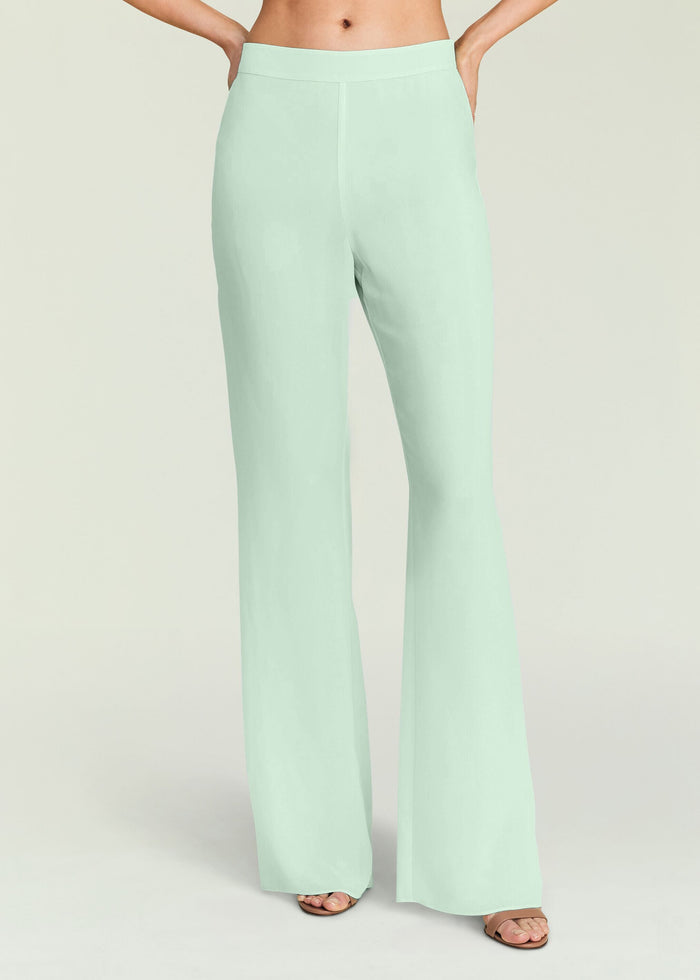 Mint green Mave Pant close up at the waist and legs with hands in pockets