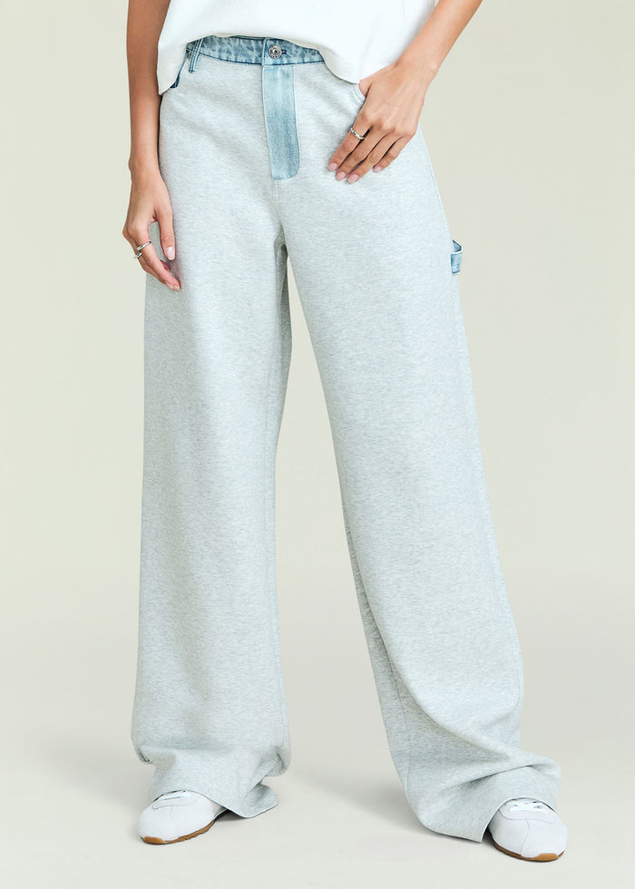 Close-up of Travis Denim Pant in light gray with a denim waistband accent and relaxed wide legs
