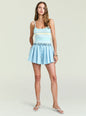 Model wearing the Nash Short pastel striped tank top with a matching light blue mini skirt. thumbnail image 2 of 5