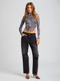 Front three quarter view of a model in a zebra print sheer wrap top with distressed black jeans and sandals thumbnail image 5 of 5