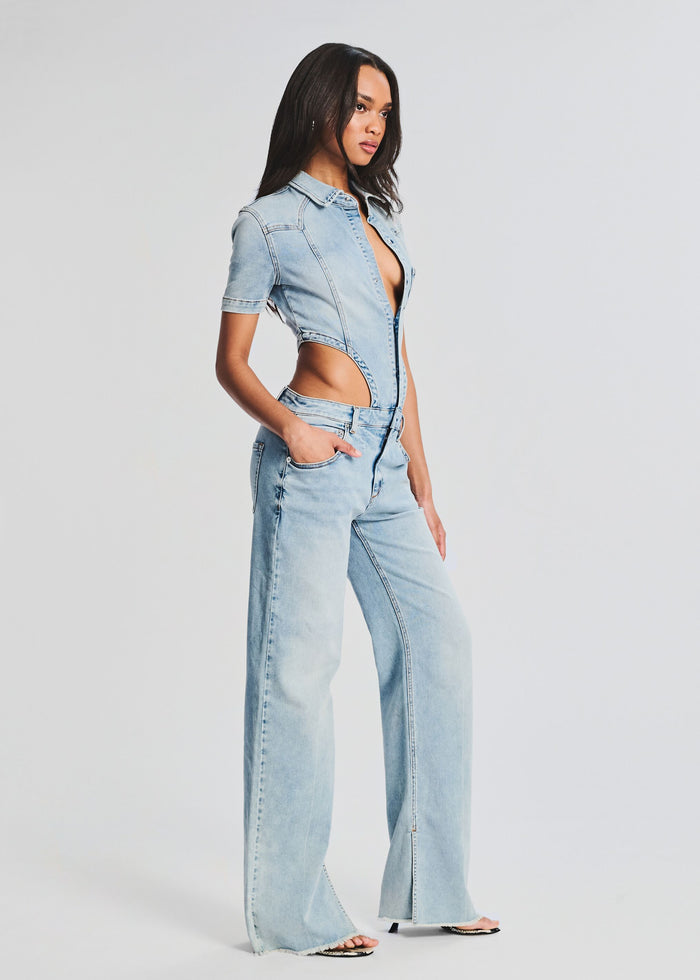 Light blue denim two piece look with cropped shirt and high waist flared jeans featuring waist cutouts