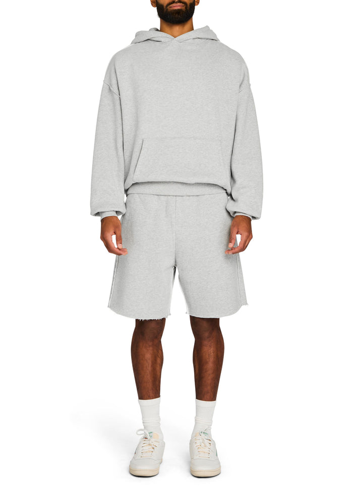 Mack Fleece Hoodie set in heather gray with oversized fit and front pocket worn with matching shorts.