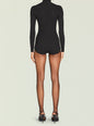 Back view of Rei Knit Romper in black ribbed knit with long sleeves and a curved hem thumbnail image 4 of 5