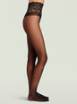 Model's leg in black sheer tights with an intricate lace top. thumbnail image 1 of 1