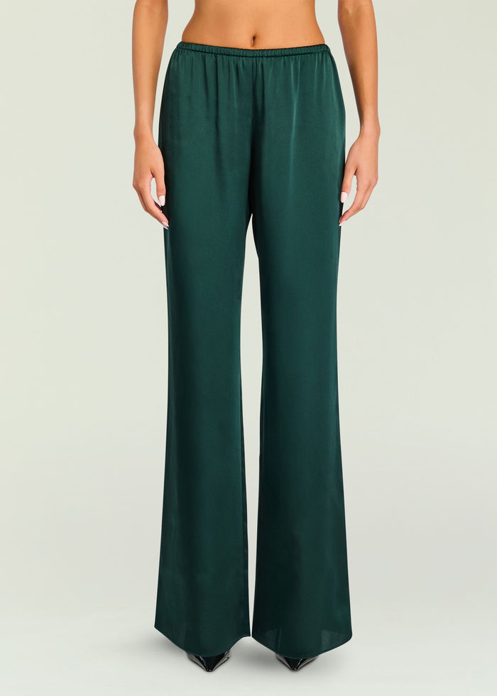 Emerald green Viva Satin Pant close-up at the waist with elastic waistband and smooth satin finish.