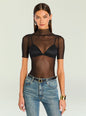 Model wears Gail Bodysuit black sheer mesh top over a bralette with denim jeans. thumbnail image 1 of 5