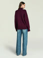 Back view of Elsa Turtleneck Sweater in deep burgundy on a model, relaxed fit with ribbed hem. thumbnail image 4 of 5