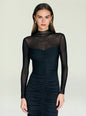 Front view of Emilyn Midi Dress with sheer mesh bodice and long sleeves on a model. thumbnail image 5 of 5