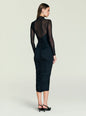 Back view of a model in the black Emilyn Midi Dress with sheer mesh back and long sleeves. thumbnail image 4 of 5