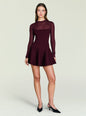 Front view of a model wearing a burgundy Joselyn knit mini dress featuring a sheer upper panel and fitted silhouette thumbnail image 5 of 5