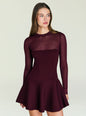 Model wearing a burgundy Joselyn Knit Mini Dress with a sheer high neckline and long sleeves. thumbnail image 1 of 5