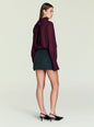 Back view of the Usha Wool Skirt on a model paired with a burgundy blouse. thumbnail image 5 of 5