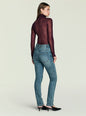 Back view of a model wearing Celia High Rise Skinny Jeans with a burgundy knit top. thumbnail image 5 of 5