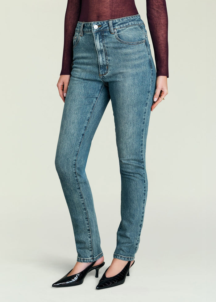 Front view of Celia high rise skinny jeans in light blue wash worn by a model