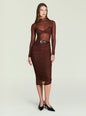Model wearing a brown ruched midi skirt paired with a sheer long sleeve top and a black belt. thumbnail image 5 of 5