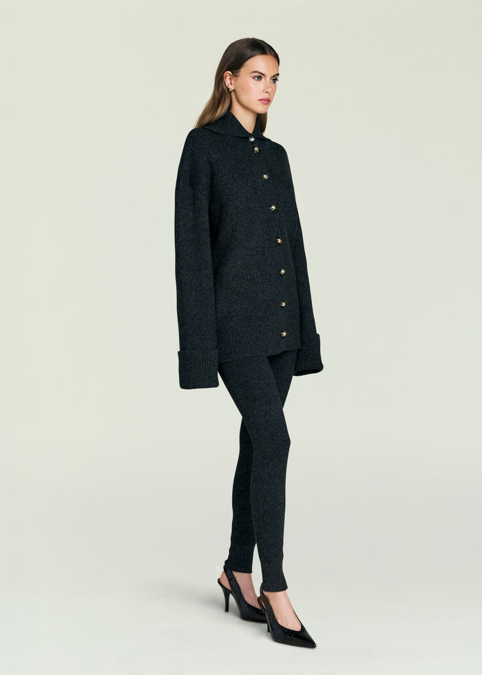 Full body view of model in Sal Sweater black knit cardigan and matching pants