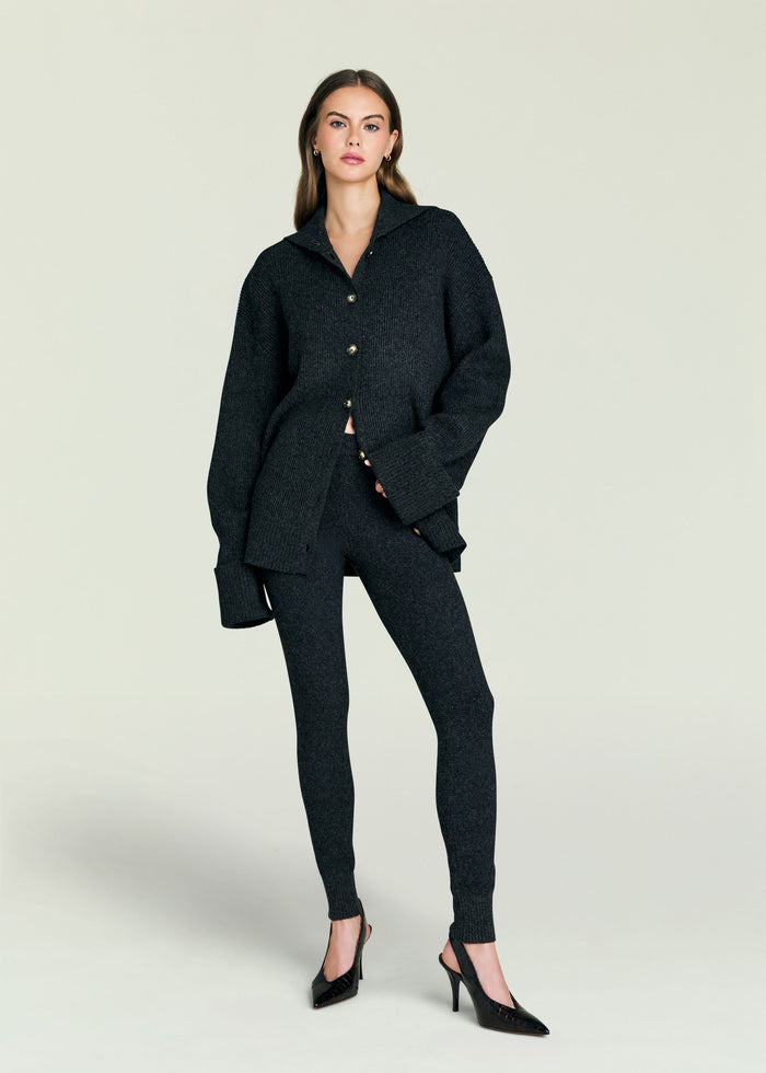 Model wearing a dark textured Sal Sweater with oversized fit and front buttons.