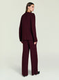 Back view of a model in burgundy Tundra Sweater wrap cardigan with matching pants. thumbnail image 4 of 5