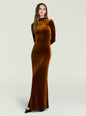 Full-length shot of a model wearing a rust velvet maxi dress with long sleeves against a pale backdrop. thumbnail image 1 of 5