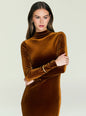 Model wearing a copper velvet maxi dress with long sleeves and a draped front thumbnail image 5 of 5