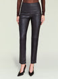 Front view of a model wearing Cyra Leather Legging in black leather with a high waist and pointed heels. thumbnail image 1 of 5