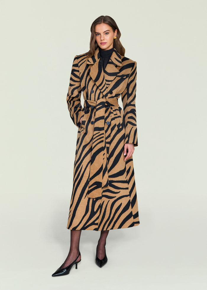 Model wearing a tan and black zebra print Petal Coat with wide lapels and a waist belt.