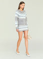 Model wearing Amaya Cardigan in gray with light blue white geometric pattern and matching skirt, beige handbag. thumbnail image 2 of 5