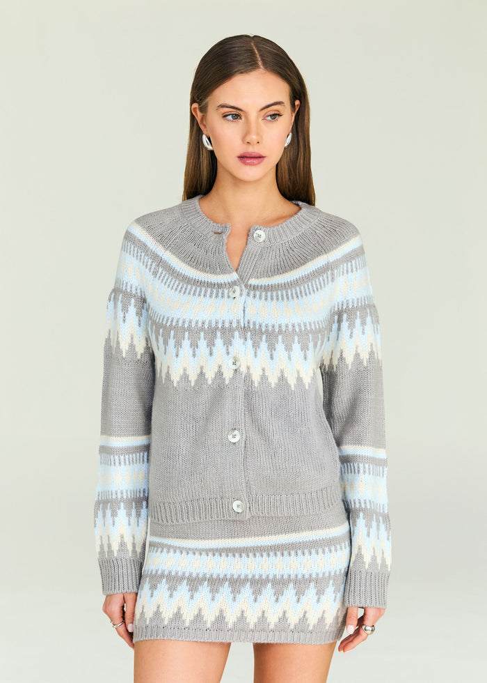Amaya Cardigan featuring grey knit with light blue and cream chevron pattern and button front