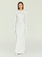 White Carina Maxi Dress with shimmering knit and fringed cuffs on the model. thumbnail image 1 of 5