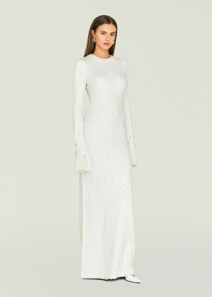 Cream knit Carina Maxi Dress featuring long sleeves with fringe cuffs.