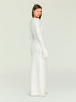Side profile of a model in the cream knit Carina Maxi Dress with fringe cuffs. thumbnail image 4 of 5