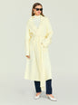 Woman wearing a pale yellow Crosby Sweater Duster coat with a belt, sunglasses, and jeans. thumbnail image 1 of 5