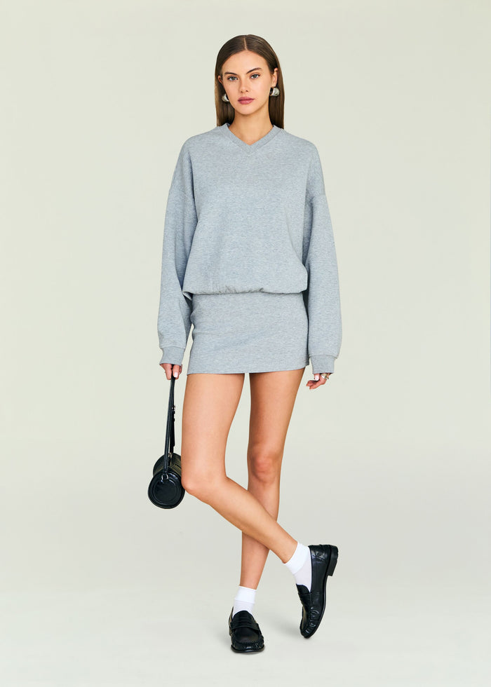 Dionne Mini Dress in heather gray with a relaxed sweatshirt silhouette and elastic waist.