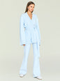 Model in pale blue knit belted cardigan and matching pants with white sneakers. thumbnail image 2 of 5