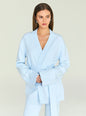 Model in a light blue cardigan with a deep V wrap neckline and belt, styled with silver jewelry. thumbnail image 1 of 5
