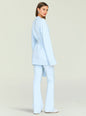 Side view of a model wearing a light blue belted cardigan with matching pants thumbnail image 4 of 5